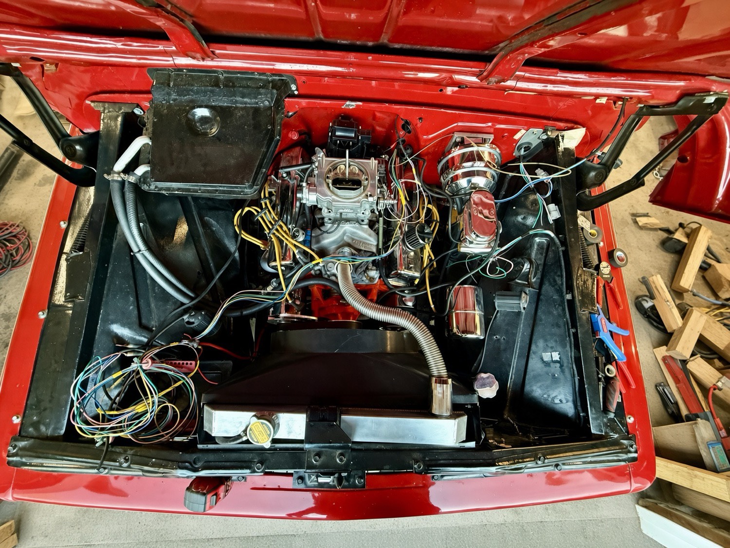 Classic C10 engine bay during custom wiring