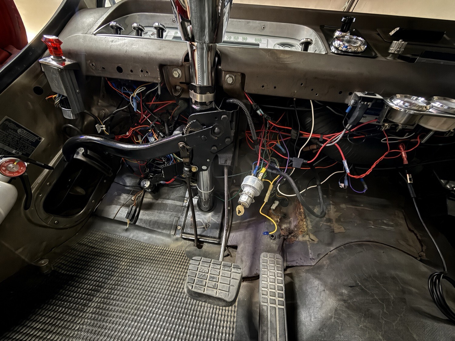 Under-dash wiring before cleanup on a classic truck